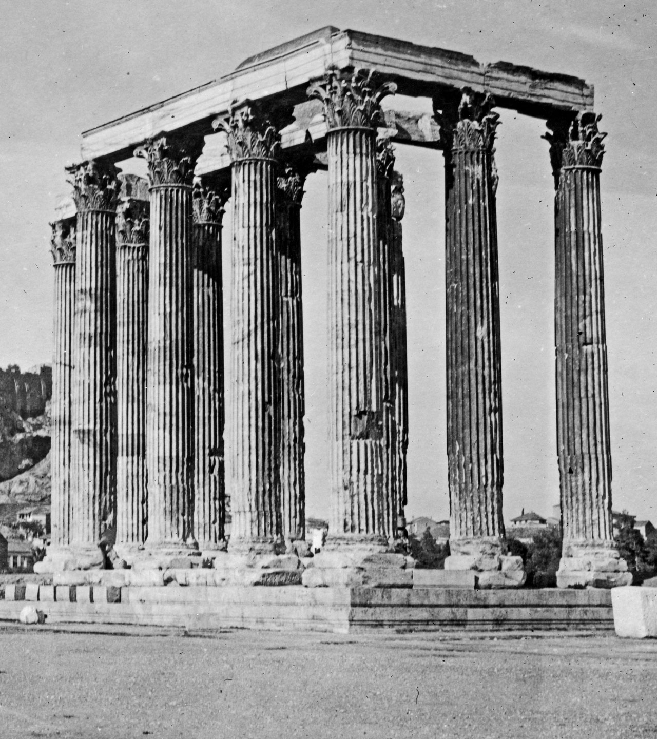 Where Fluted Columns Originated. The Temple of Jupiter near the Acropolis at Athens, the original fluted column structure, and the pattern of which is now used for all first class bank buildings, lamp posts and courthouses back in America. Before this magnificent ruin there was established the first ARC relief station in Athens, where thousands of Greek sufferers from the war were cared for. Below it is the Red Cross hospital where Greek girls are learning modern nursing methods under American instruction. America came to Greece for its architecture and in return has taught Greece better standards of living