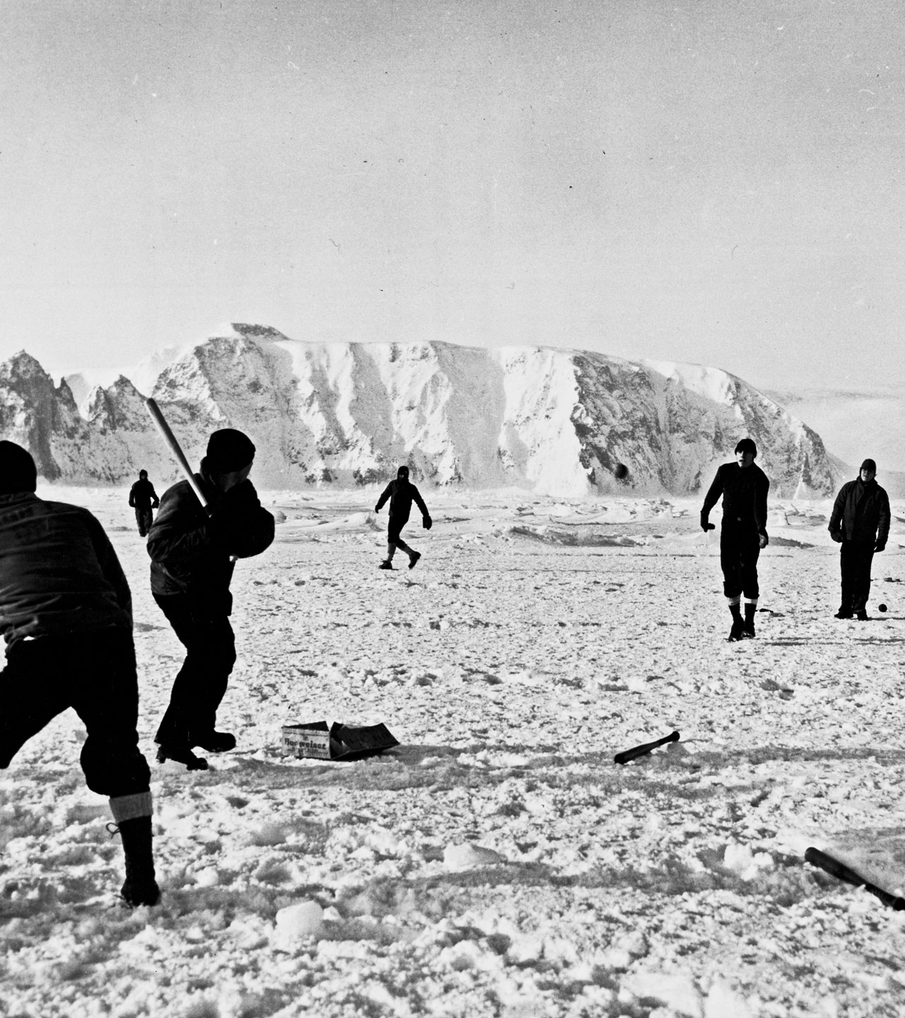 [Coast Guardsman from the icebreaker Northwind playing baseball in sub-zero sunshine on shore-fast ice in the Bering Sea]